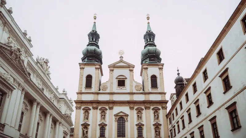 A building with towers and several windows in medieval architectural style.