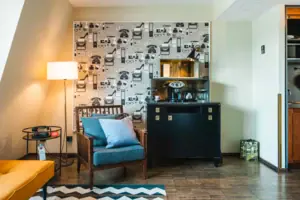 An armchair next to a wardrobe in a suite.
