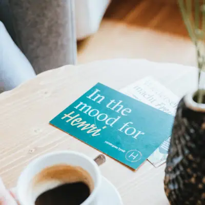 A person is holding a cup of coffee.