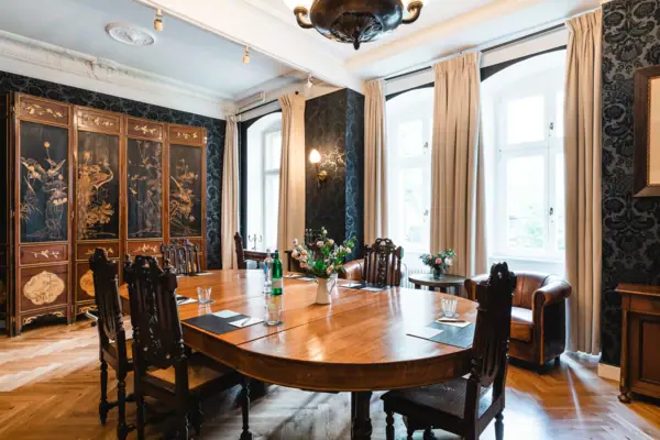 A room with a table and chairs.