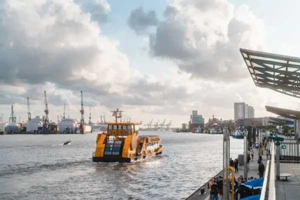 A boat on the water under a cloudy sky.