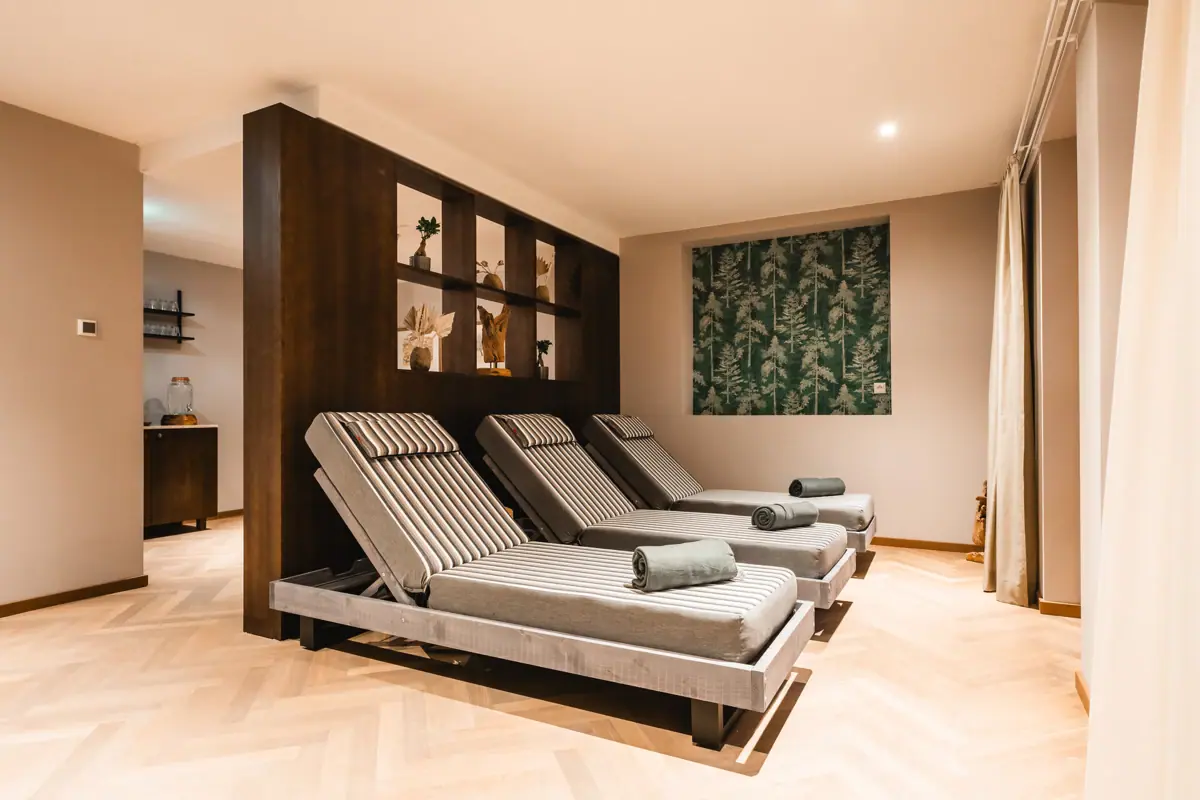 A room with chairs and a wall.