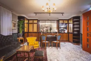 A room with a table and chairs.