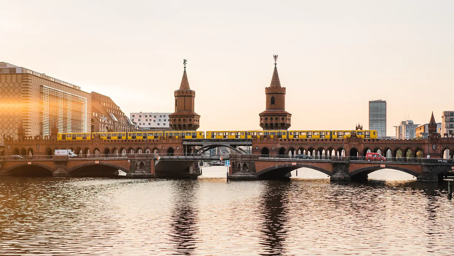 A train is crossing a bridge over water.
