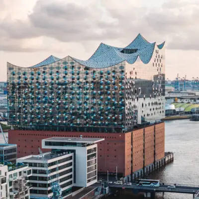 Building with large body of water in the foreground.