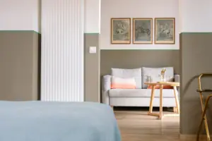A room with a sofa and a table.