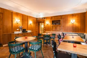 A room with tables and chairs.