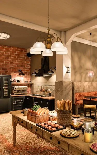 Kitchen with a table full of food.