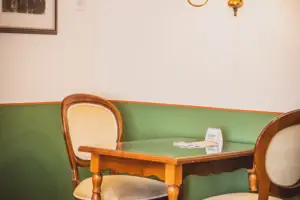 A table and chairs in one room.