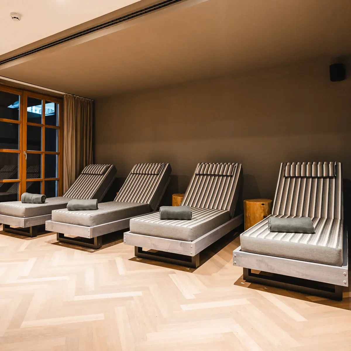 A group of deckchairs in a room.
