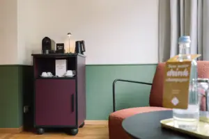 A coffee machine on a shelf in a room