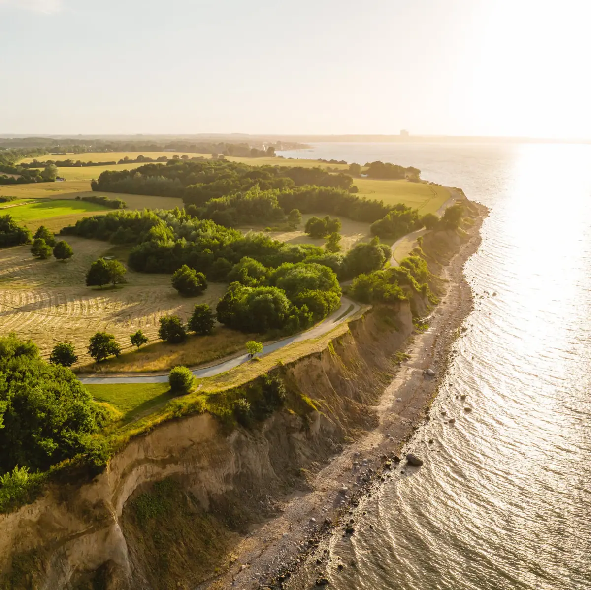 Aerial view of the Brodten cliffs with a grassy area on the Baltic Sea in Travemünde.