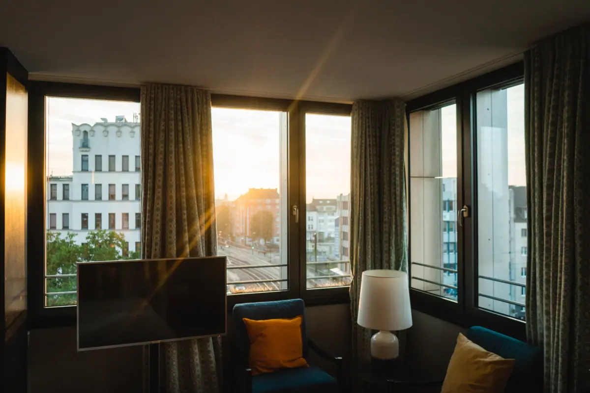 A room with a television and a window.