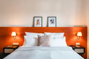 Bed with white ceiling and red headboard