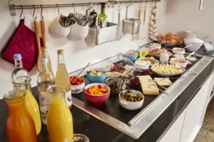 A buffet with a variety of food and drinks.