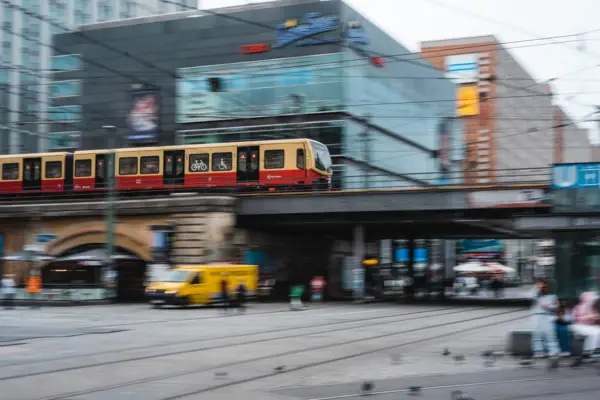 A train on a bridge in the open air.