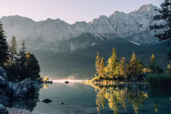 The Eibsee with trees and mountains in the background near Garmisch-Partenkirchen.