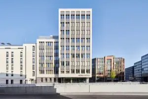 A building with many windows against a clear sky.