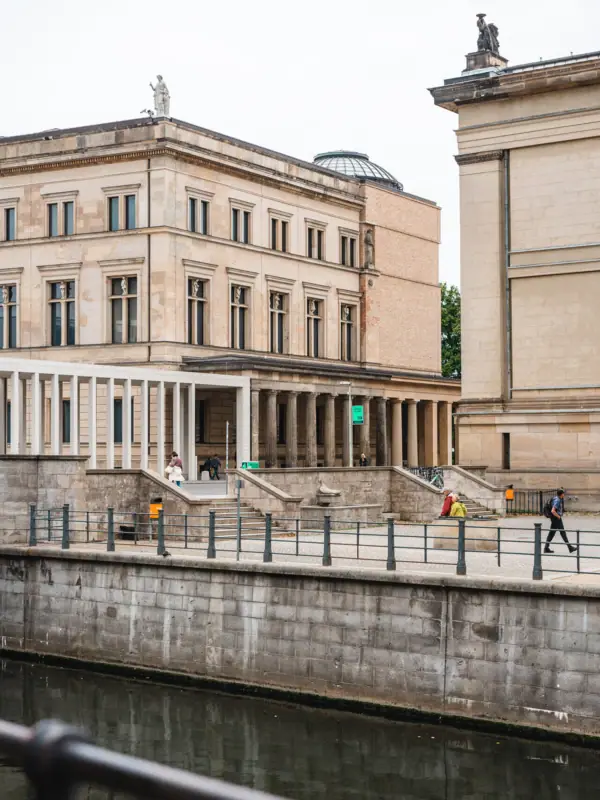 A building by a river with water.