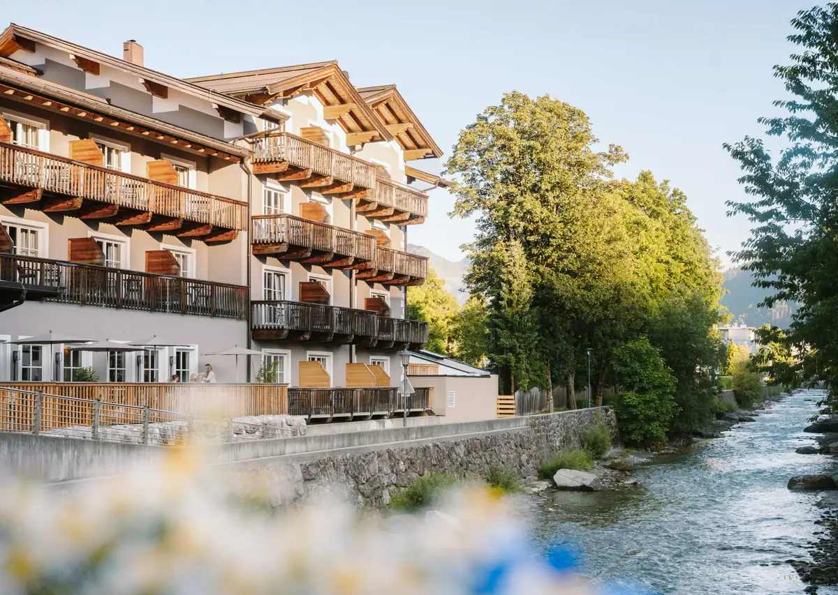 HENRI Kitzbühel The HENRI Hotel Kitzbühel, with balconies overlooking the river.