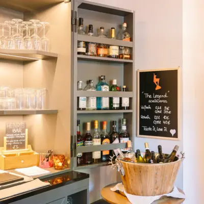 A shelf with bottles of alcohol.