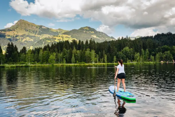 Woman on a paddleboard on a lake