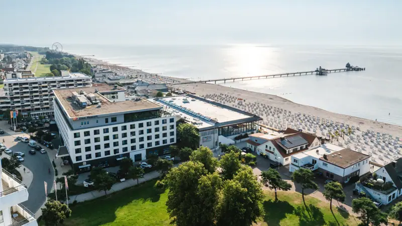 The aja Hotel in Grömitz photographed from the air with its direct location on the Baltic Sea.