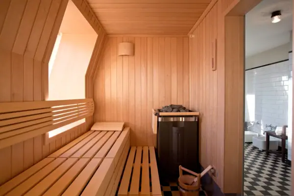 Finnish sauna at the HENRI Hotel Hamburg Wooden bench in a sauna