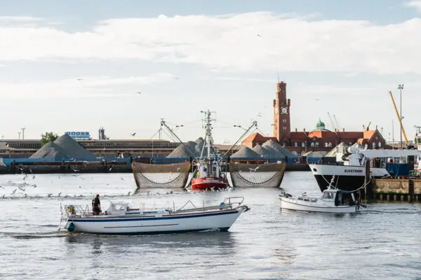 Boats in the harbour at Cuxhaven, with a building in the background